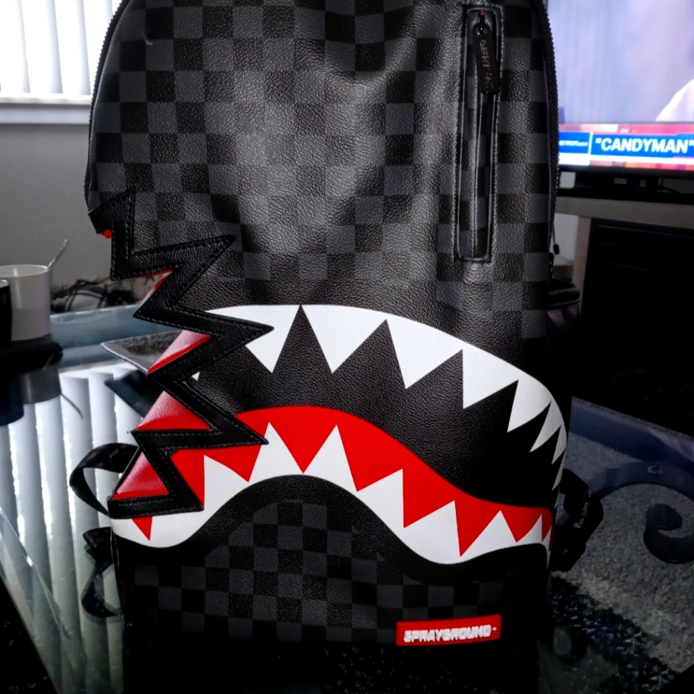 Back Pack, with slight wear an tear along the bottom of this full size backpack.